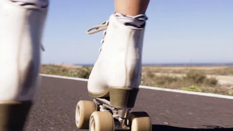Feet of person while roller skating on the country road 스톡 동영상 71548915