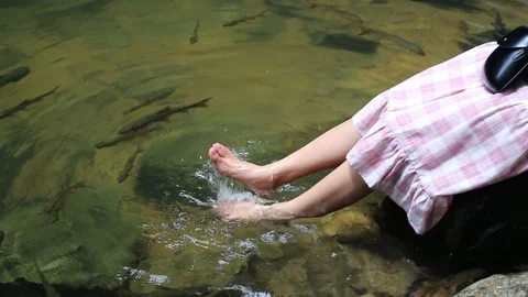 Feet playing in the water  Stock Footage 117741362