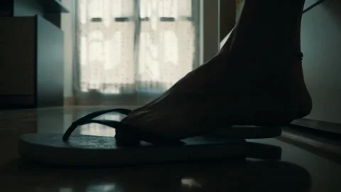 Feet putting on flip-flops and walking away from bed Stock Footage 287136089