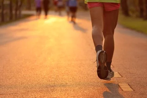 Feet of runner in evening light Stock Photos