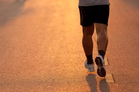 Feet of runner in evening light Stock Photos