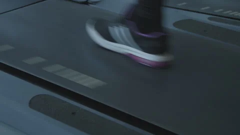 Feet running fast on a treadmill Stock Footage 235441803