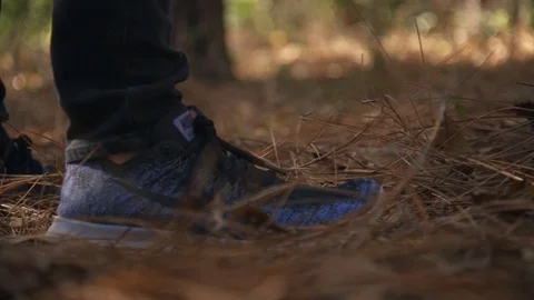 Feet running though the woods Video stock 104672747
