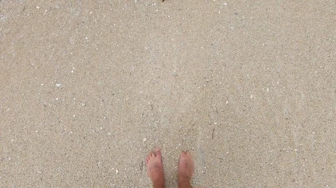 Feet in the sand on the beach Stock Footage 107269229