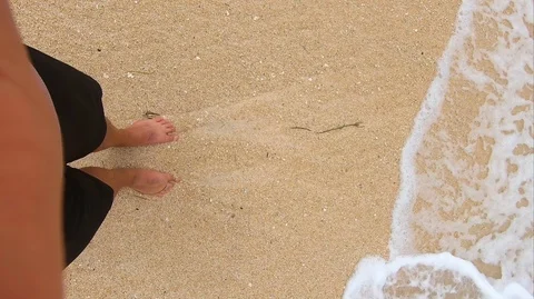 Feet in the sand on the beach Stock Footage 107269251