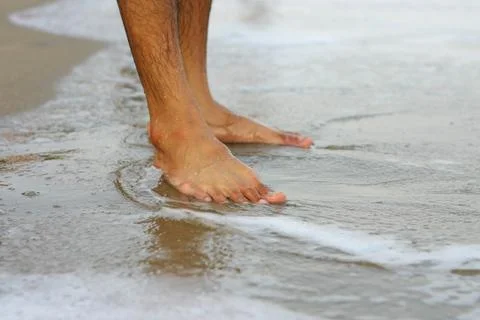 Feet on a sand Stock Photos
