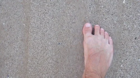 Feet in the sand at sea Stock Footage 73337460