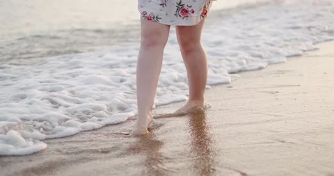 Feet on a sandy beach close up Stock Footage 133719516