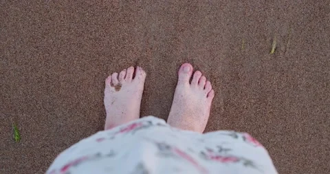 Feet on a sandy beach close up Stock Footage 133719556