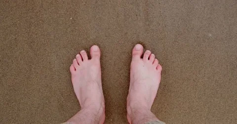 Feet on a sandy beach close up Stock Footage 133721237