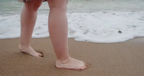 Feet on a sandy beach close up Stock Footage 133721356