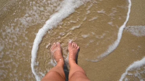 Feet on sandy beach Stock Footage 136459858