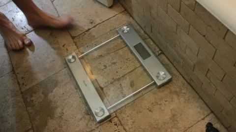 Feet on scale 200 lbs. Stock Footage 16829439