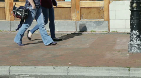 Feet shoot two couples walk past dor way Stock Footage 36228300