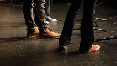 The feet of singers performing on a stage before a live audience Stock Footage 82303394