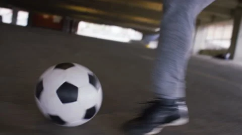 Feet of a skillful soccer player doing quick movements with his football Stock Footage 61915701