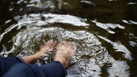 Feet Soaking in Waterfall Stock Footage 101049912