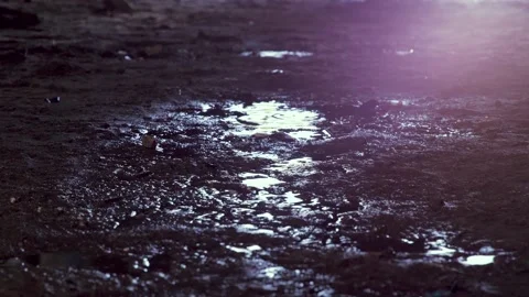 Feet of soldier in army boots moving forward in mud and puddle. Soldier stepping Stock Footage 132428391