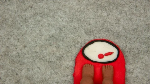 Feet stand on the weight, pointer moves to the maximum. Stock-Footage 114511545