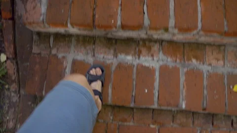 Feet step on a stone staircase Stock Footage 128104269