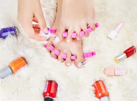 Feet in toe separators Stock Photos