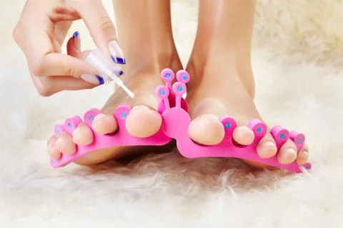 Feet in toe separators Stock Photos