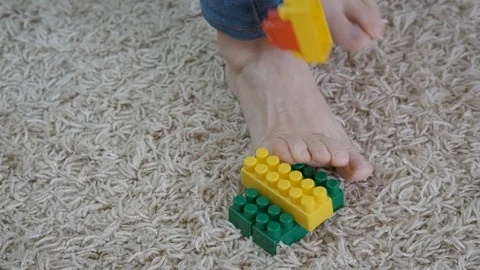 Feet on the toy. Stock Footage 127059408