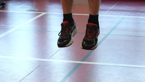 Feet in trainers dropping to floor Stock Footage 103327460