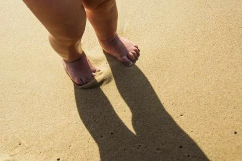 The feet that trample the sand Stock Photos