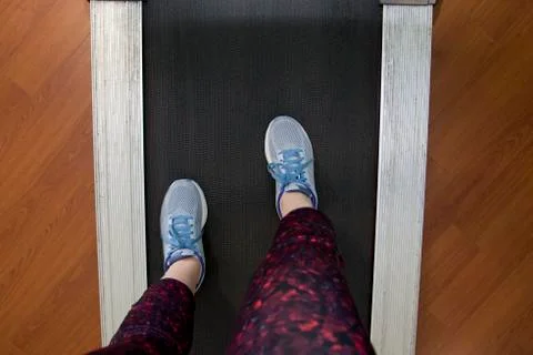 Feet on a treadmill Stock Photos