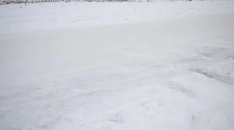 Feet of two men jogging in winter on white snowy road Stock Footage 46995595