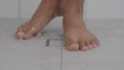 Feet view of man taking bath shower Video stock 209919698