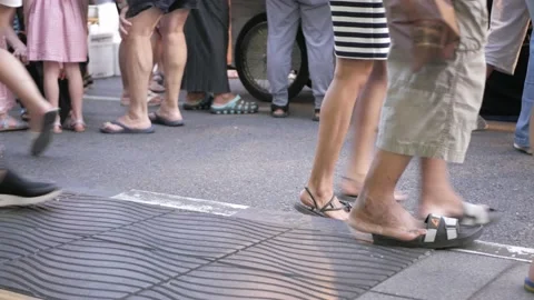 Feet view to the walking street while many crowded people walking Stock Footage 206784979