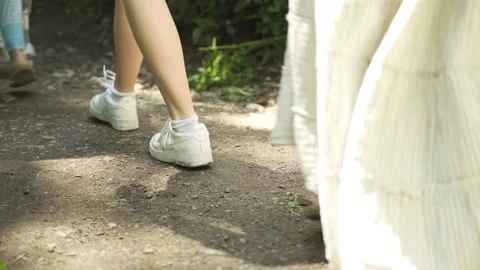 Feet walking down path Stock Footage 139146276