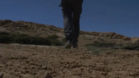 Feet walking on the mountains Stock Footage 141787973