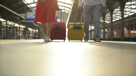Feet Walking On The Platform Passengers With a Suitcase. Young Couple Walking Stock Footage 120355380