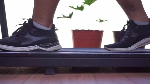 Feet walking on treadmill machine, home fitness workout, exercise equipment, Stock Footage 345293617
