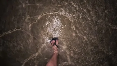 Feet Walking in the Water of Sandy Beach at Night in Sihanoukville, Cambodia 스톡 동영상 337050491