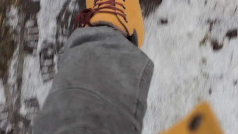 Feet walking in winter forest path hike Video stock 124857493