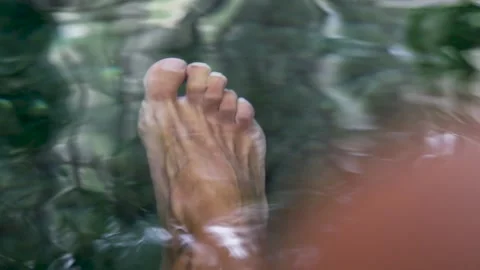 Feet in the water in a pond Video stock 283461256