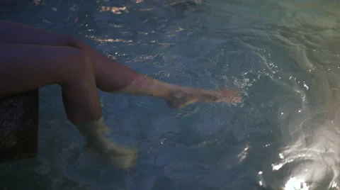 Feet waving in the pool Stock Footage 63869514