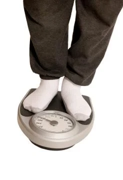 Feet On Weight Scale Stock Photos