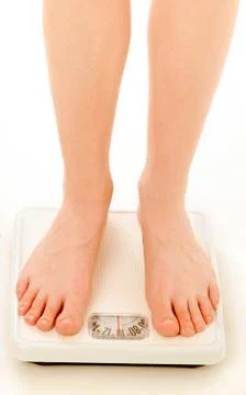 Feet On Weight Scale Stock Photos