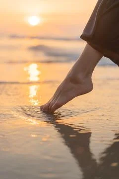 The feet in wet beach Stock Photos