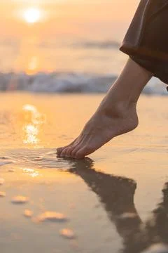 The feet in wet beach Stock Photos
