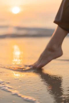 The feet in wet beach Stock Photos