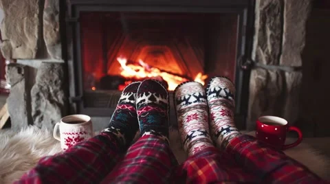 Feet in woollen socks by the Cozy Burning Christmas fireplace. 4K. Stock Footage