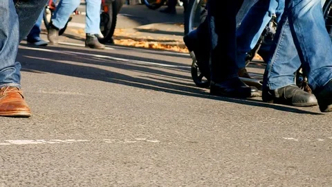 Feets of angry marchers during a protest in France. Close up low angle Stock Footage 121200419