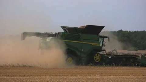 Fehmarn, Schleswig Holstein/ Germany - July 28th 2020: Combine harvester with Stock Footage