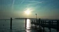 Fehmarn sunset relax with boat at small dock HD Footage